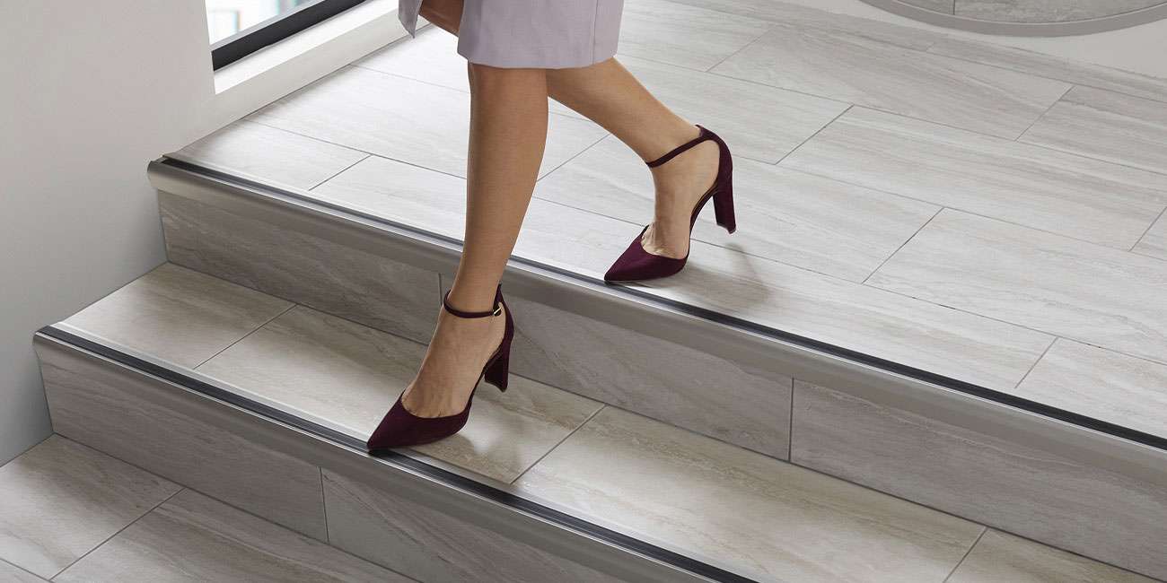 woman walking down steps