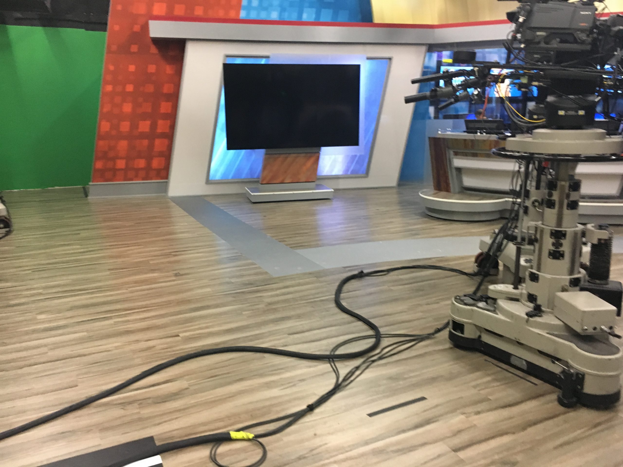 Wesh Studio flooring with camera and television