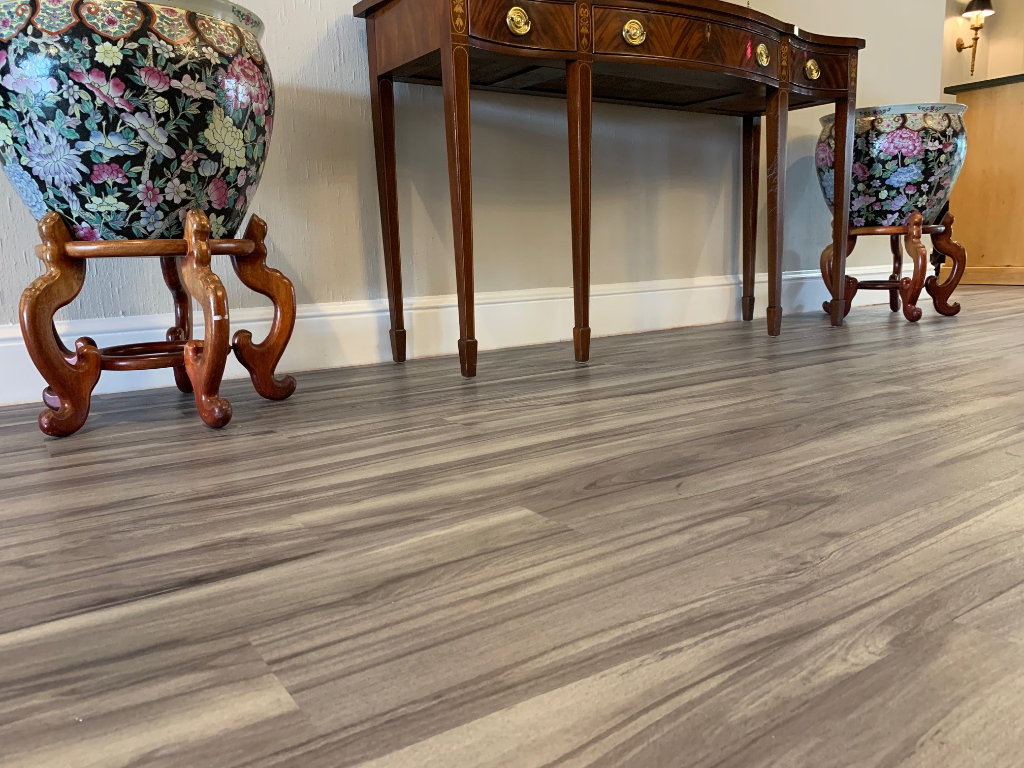 Flooring near a table and two vases