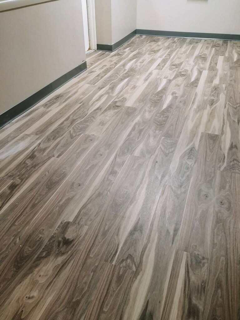 Hallway in building with wood grain floor