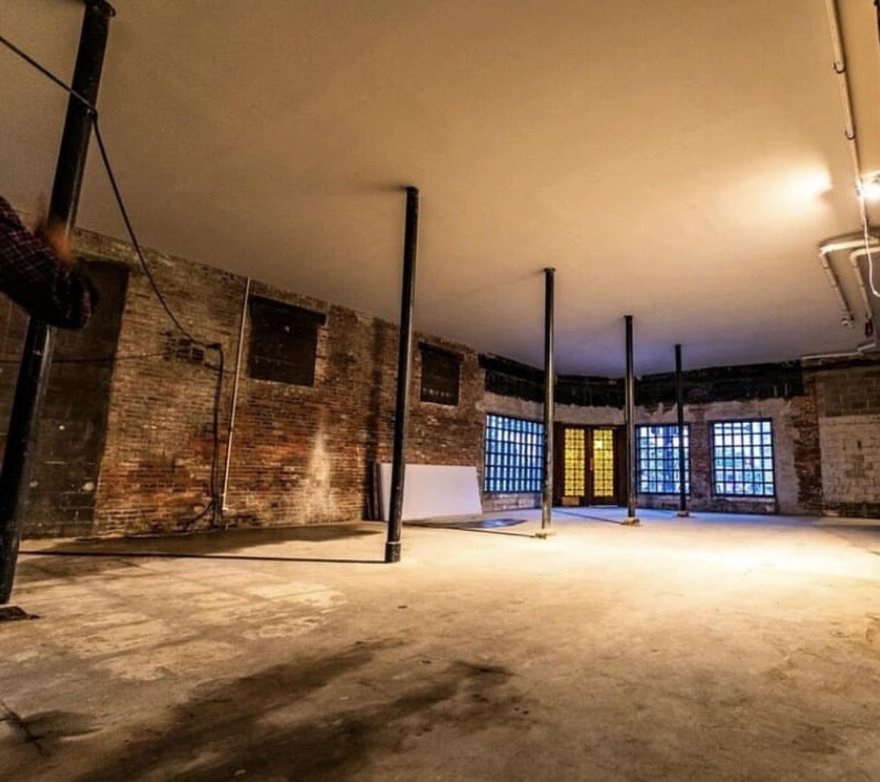 Empty room with brick walls and concrete floor