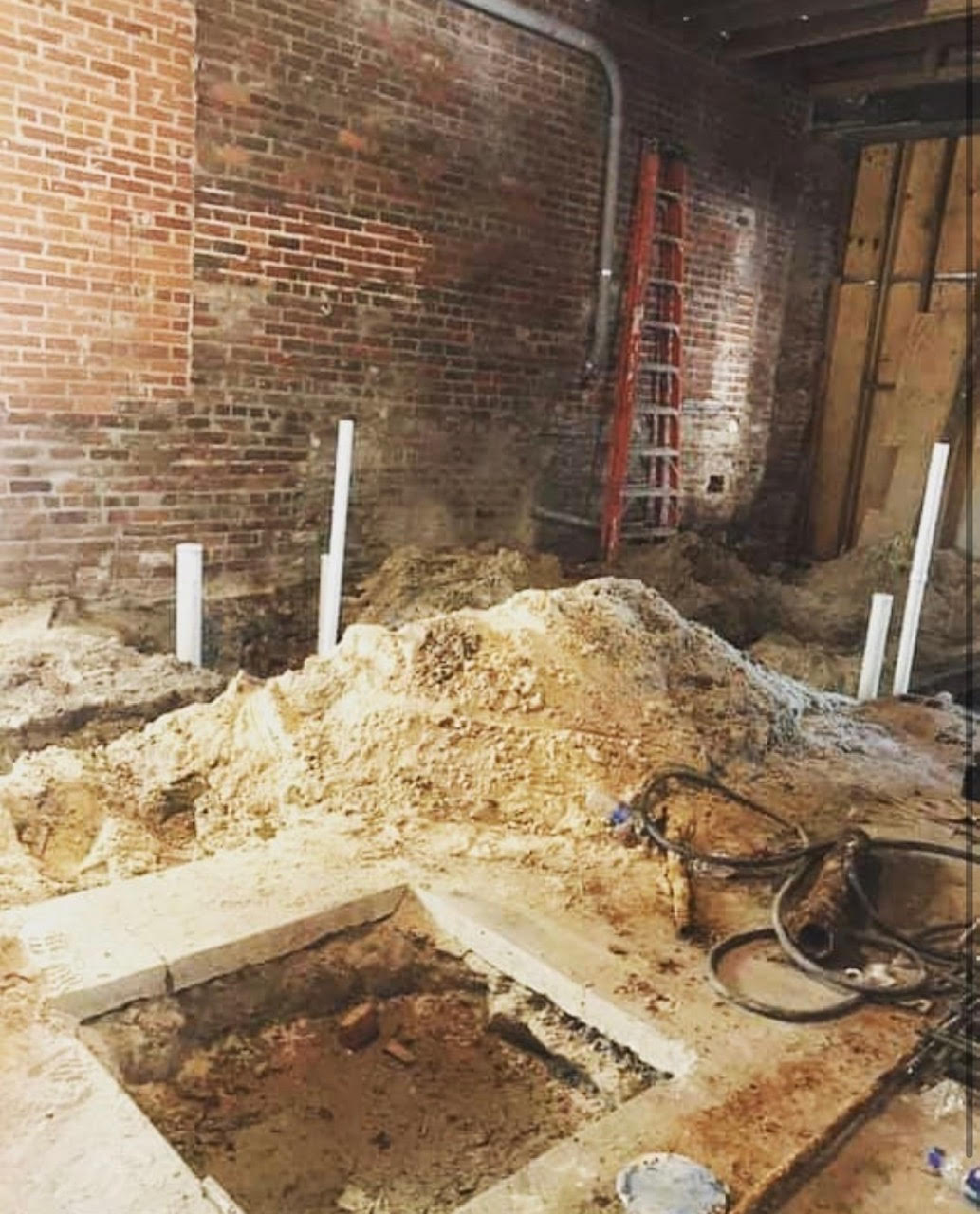 Concrete floor with hole in it, construction site