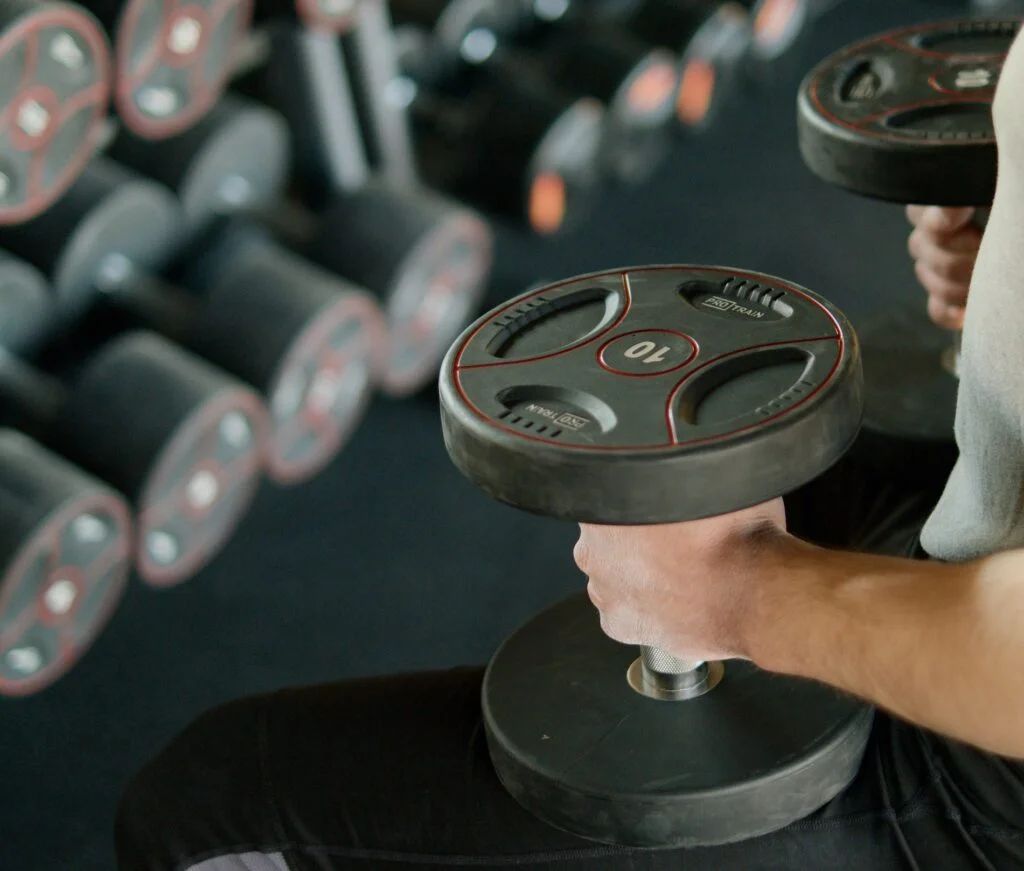 Man holding a weigh in a gym